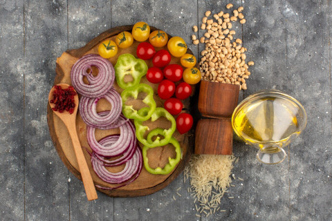 Mediterranean Diet 101: Key Principles and Health Benefits 60 top view vegetables sliced whole such as onions tomatoes brown desk grey wooden rustic background 140725 13786