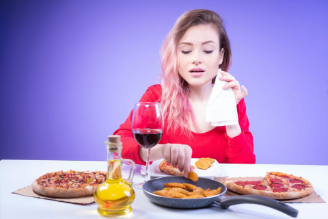 Hidden Sources of Sodium: What You’re Eating Without Realizing 42 beautiful woman with napkin one hand takes wedge fried potato 141793 1002