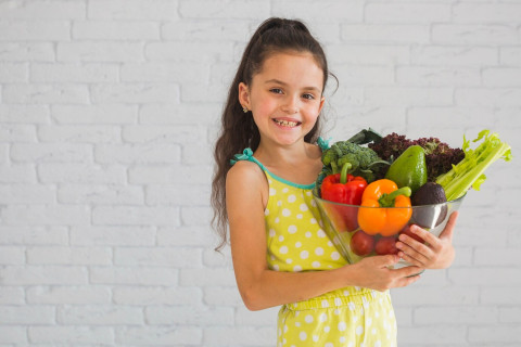 Vegetables That Don’t Taste Like Vegetables: Great Picks for Picky Eaters 42 girl standing front white wall holding vegetable bowl 23 2147855362