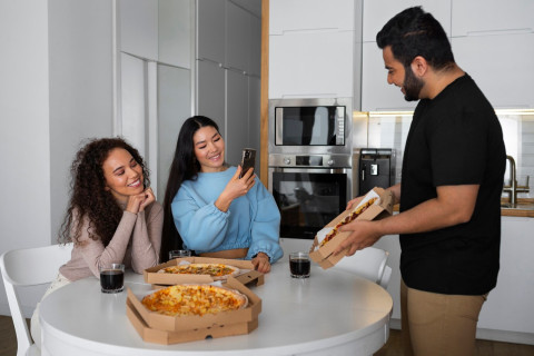 Fast Food Swaps: Make Your Favorite Takeout at Home 42 group friends eating pizza home together 23 2150419423