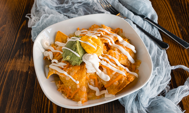 nachos with cheddar sauce and guacamole 2025 02 09 22 34 49 utc