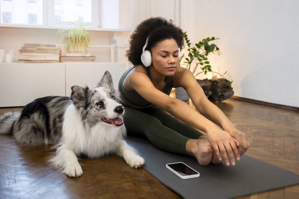 Daily Exercise Routines for Pets: How to Keep Your Furry Friends Active and Fit 43 person doing yoga accompanied by her pet