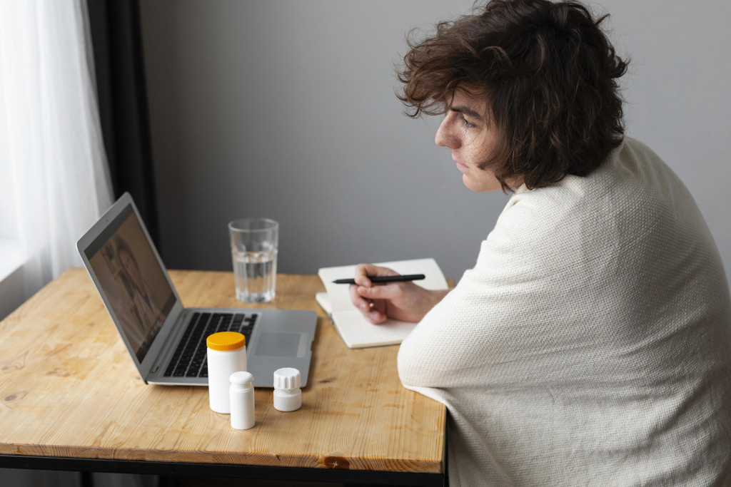 Managing Pandemic Stress: Mental Health Tips for Uncertain Times 43 sick young man talking his doctor by videocall