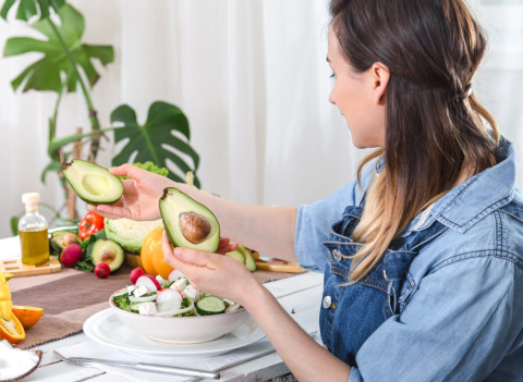 Simple Habits for Eating Healthier Every Day 44 young happy woman looking avocado dinner table 169016 6394